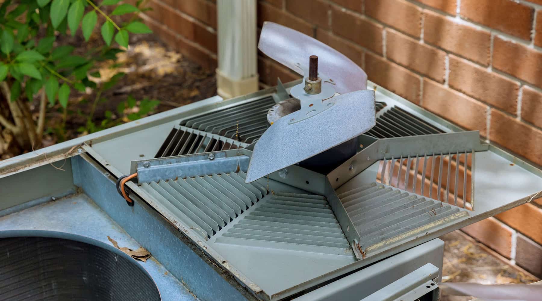 Detailed view of an air conditioner with a visible fan
