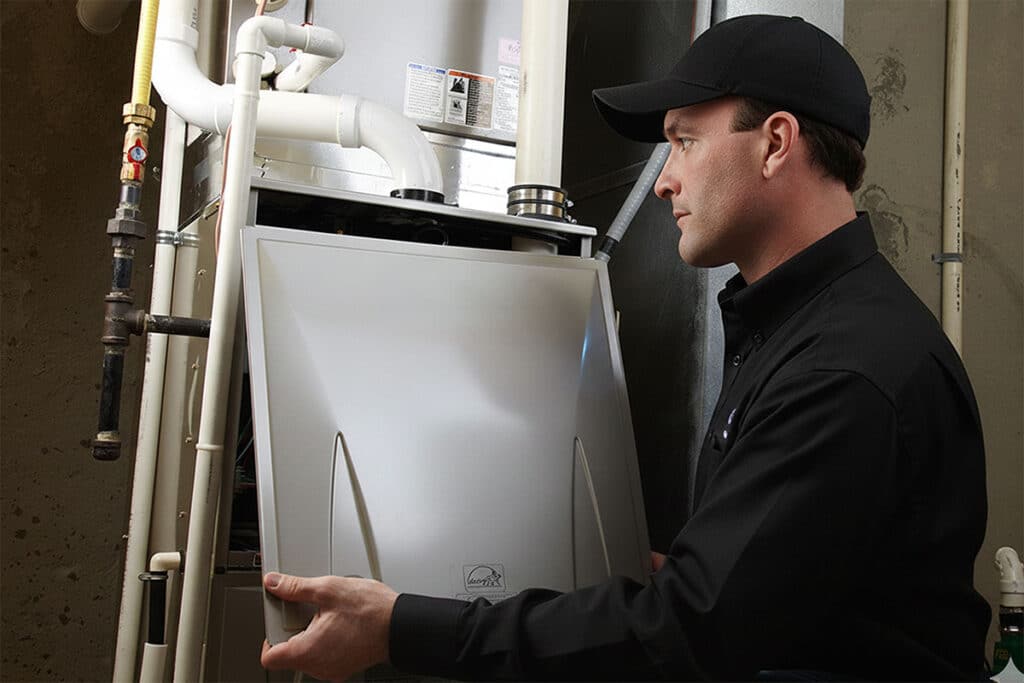 HVAC tech installing new furnace