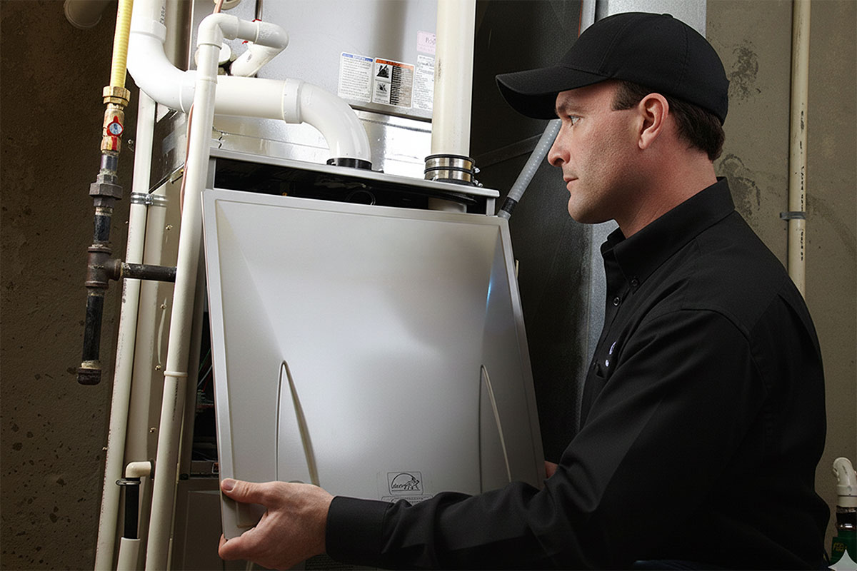 HVAC tech installing new furnace