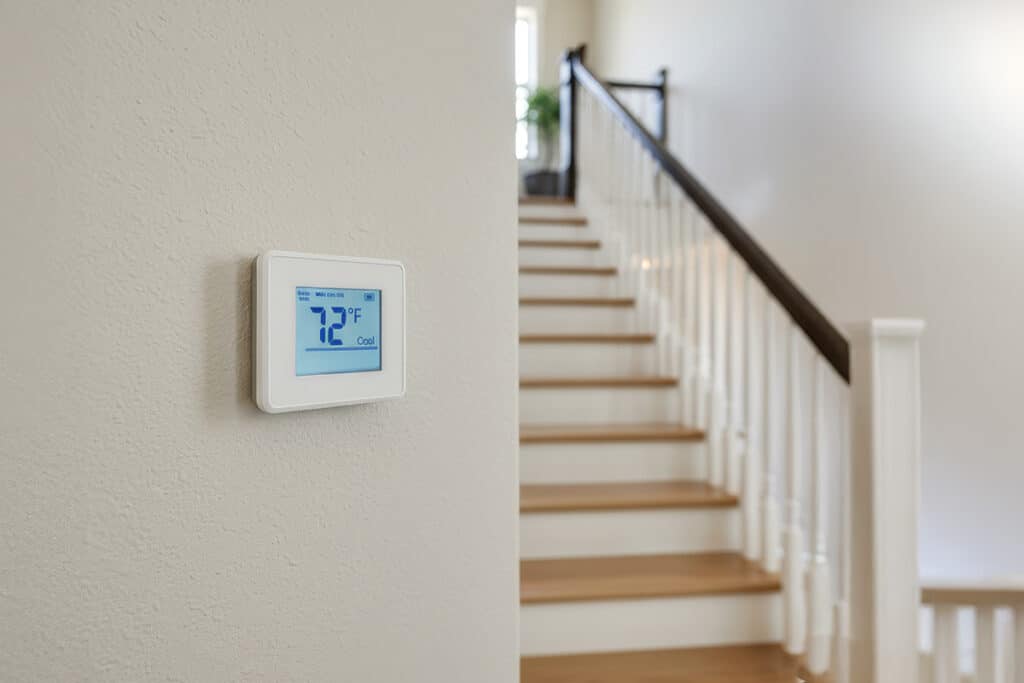 thermostat on wall in a  hallway